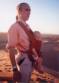 Attachment parenting principles and benefits - carrying - Andrew Green with Fingal on the Saharan dunes in Morocco